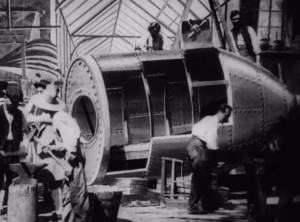 George Melies "A Trip To The Moon". Factory workers hammer a rocket into shape.